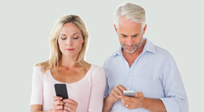 Williamson couple using smartphones