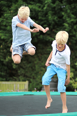 image of kids playing on a trampoline
